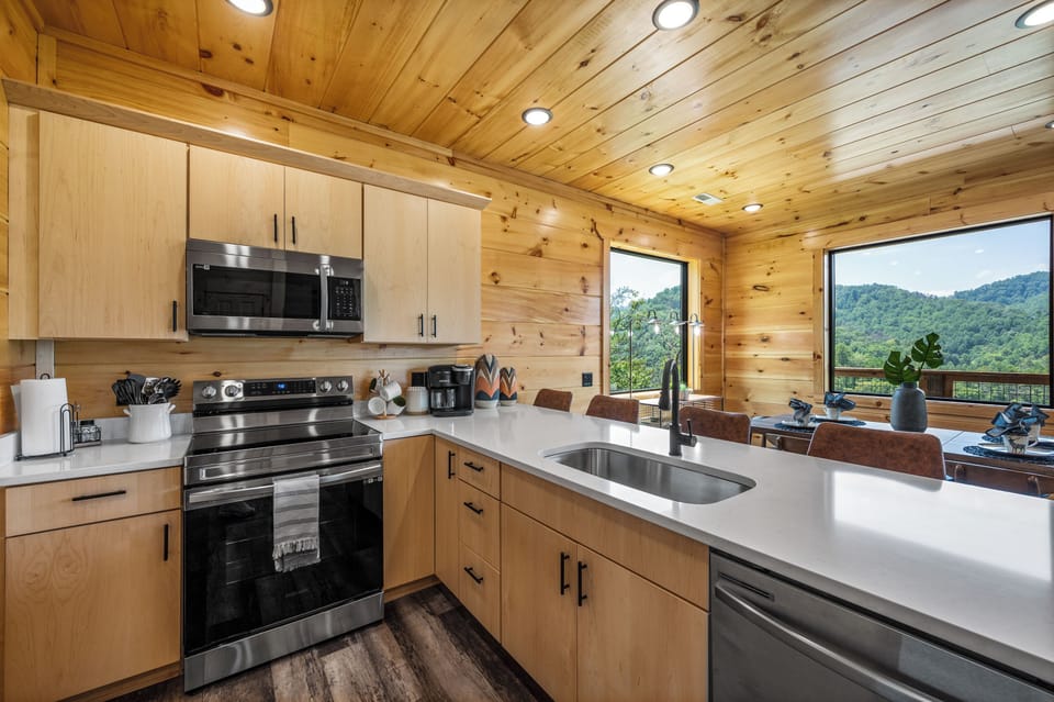 Kitchen and open dining area featuring mountain views