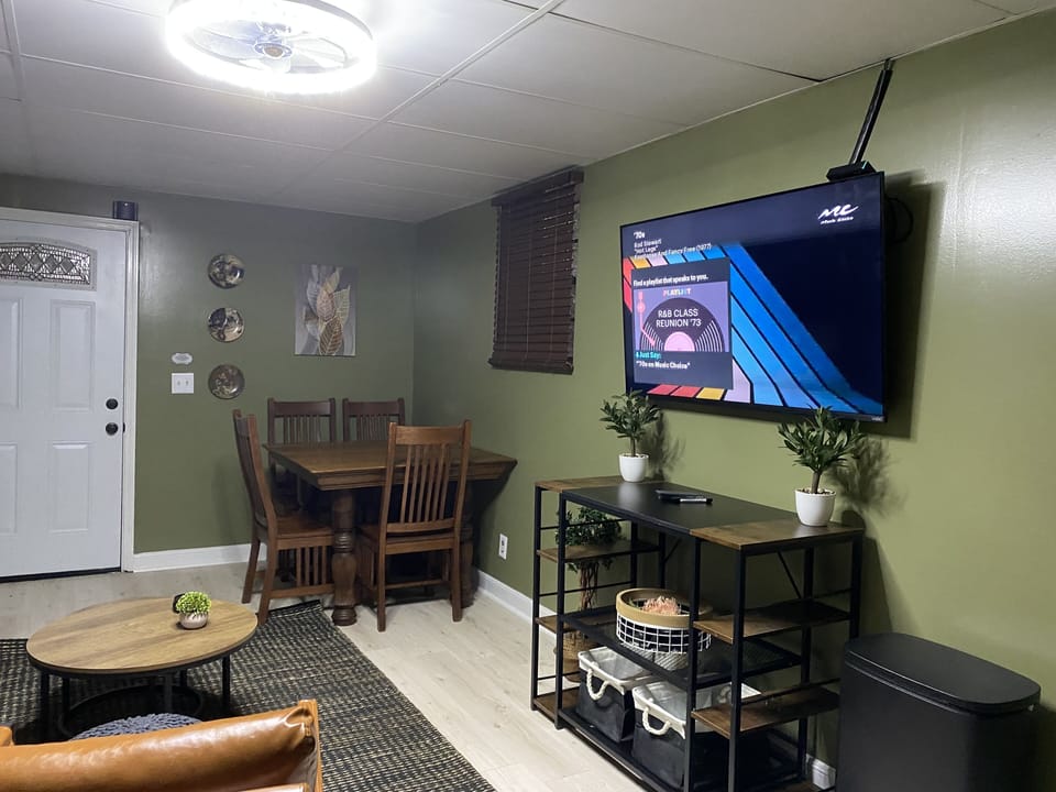 Downstairs living room: tv and board games, twin bed