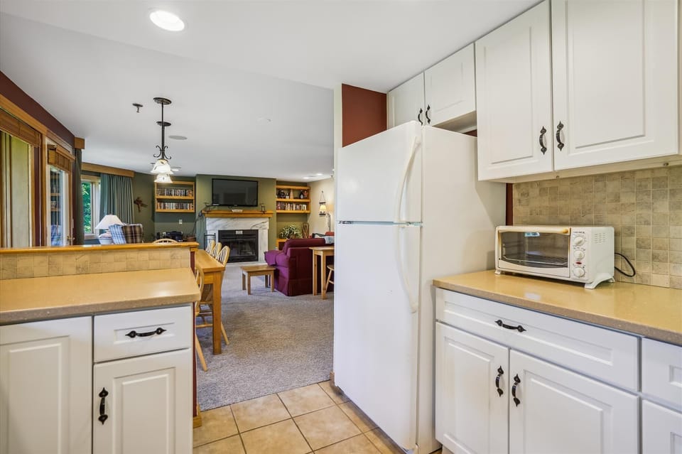 Well-equipped kitchen with plenty of counter space and an open view into the dining and living areas.