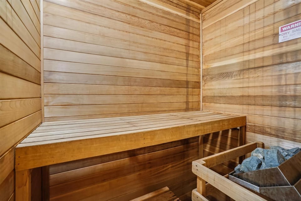 Private In-Unit Sauna - Comfortable bunk bedroom with flexible sleeping arrangements and plenty of natural light.