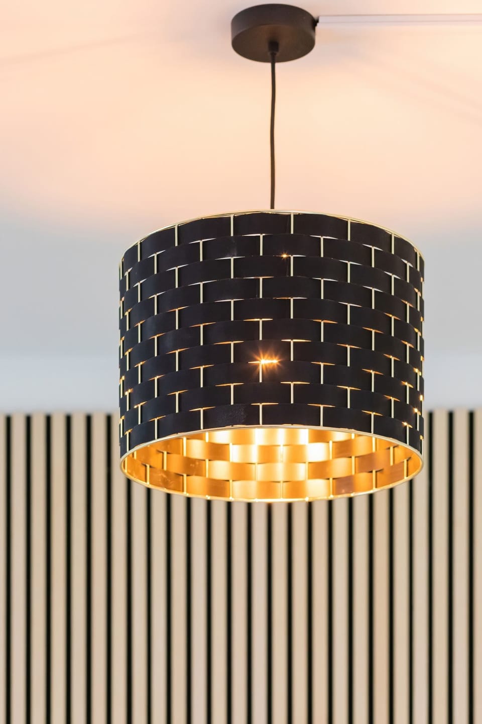 A decorative pendant light with intricate detailing, adding a sophisticated touch to the room's atmosphere.

