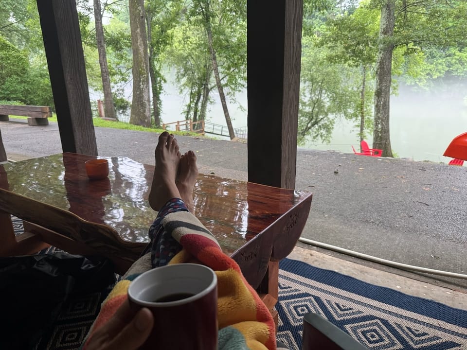 A quiet morning watching fog on the river with coffee and a book