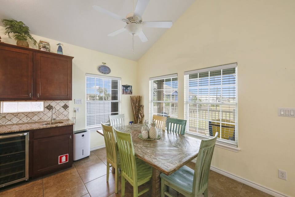 Bright dining area with coastal accents and comfortable seating for shared meals.