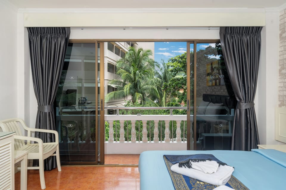 Deluxe Room Pool View | In-room safe, desk, blackout drapes, free WiFi
