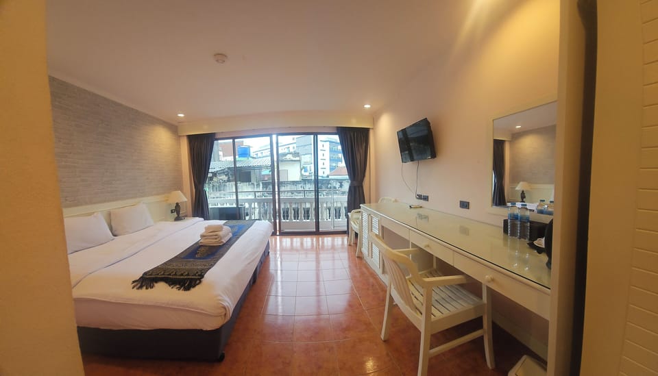 Deluxe Room with Balcony | In-room safe, desk, blackout drapes, free WiFi