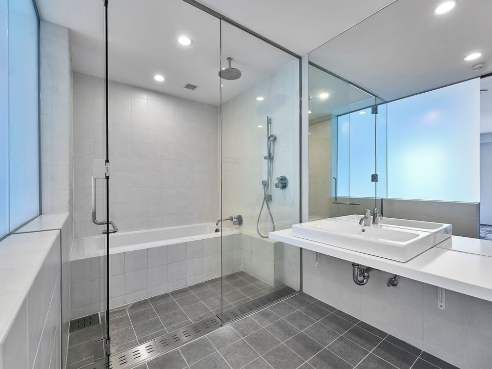 Combined shower/tub, free toiletries, hair dryer, slippers