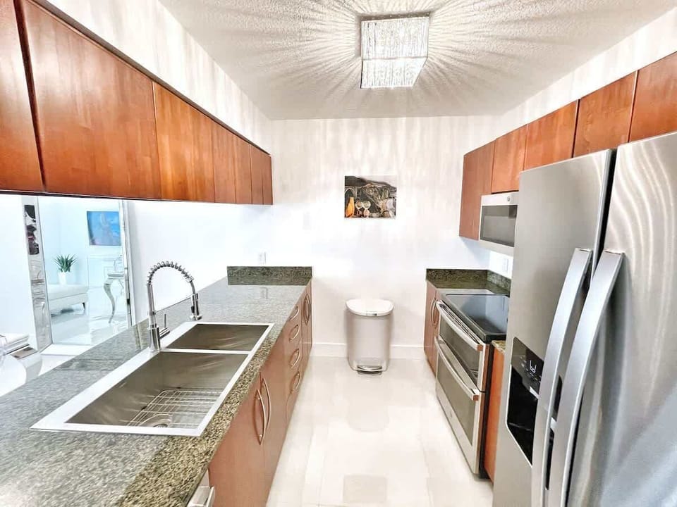 Fully stocked kitchen with complete set of cookware.