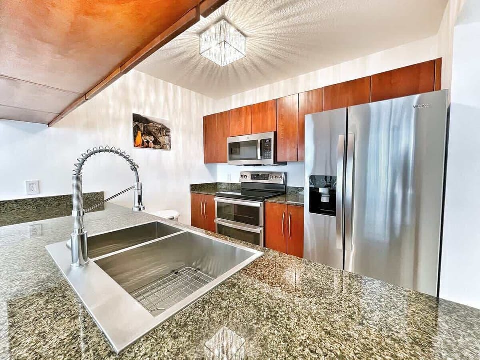 Fully stocked kitchen with complete set of cookware.
