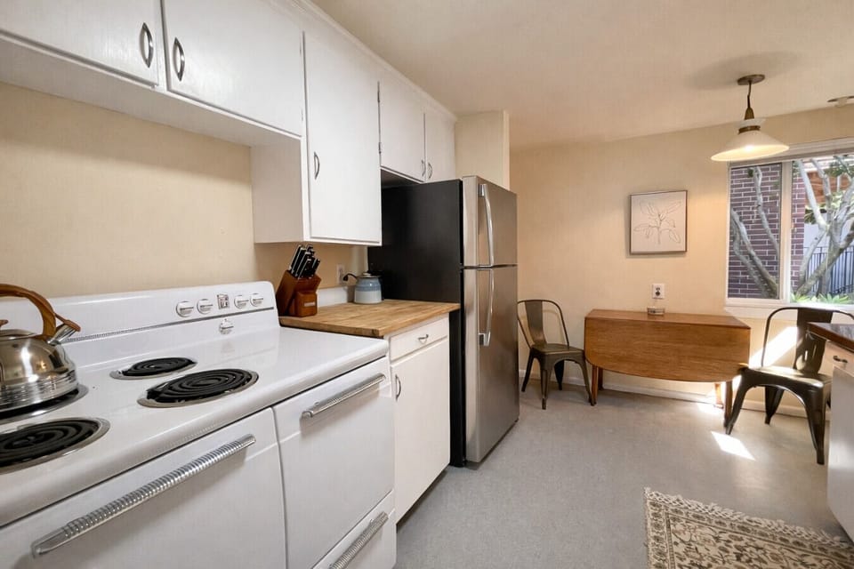 Fully equipped modern kitchen with full-size appliances, ample counter space, and everything you need to cook at home.