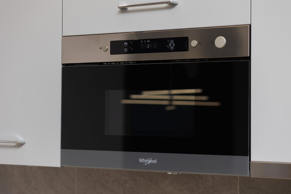 Fully equipped kitchenette with a microwave.