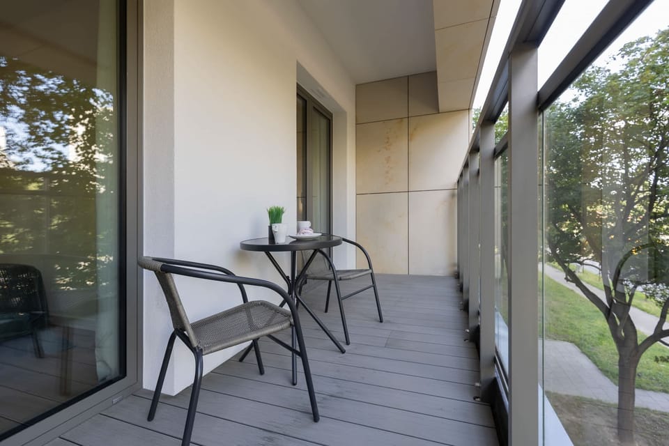 Balcony with garden furniture.