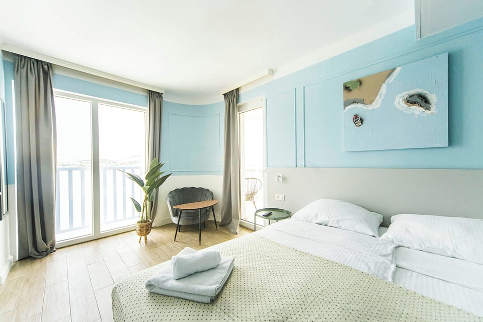 Standard Double Room, Sea View | Minibar, in-room safe, desk, laptop workspace