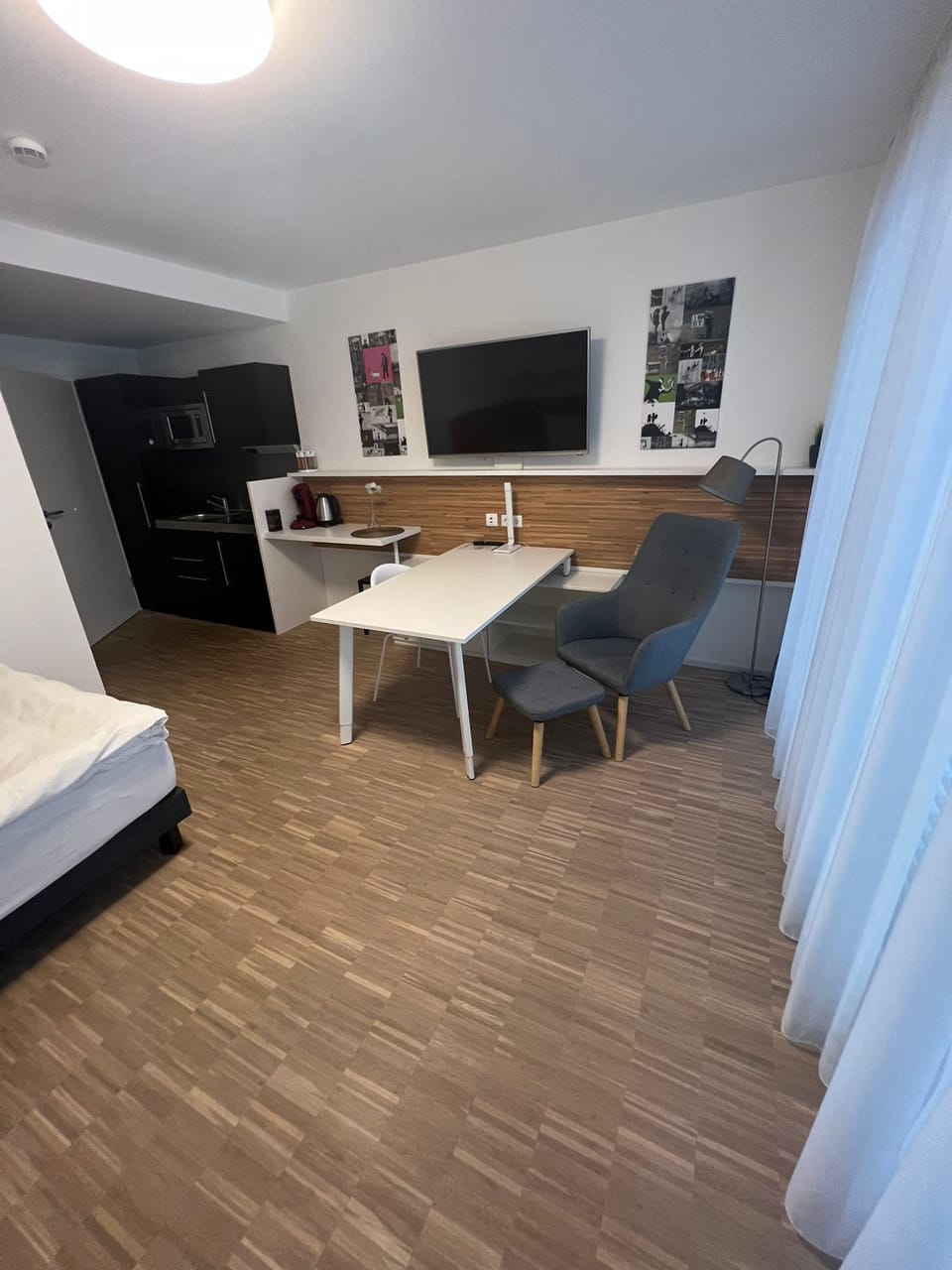 Basic Single Room | Living area | 50-inch Smart TV with cable channels