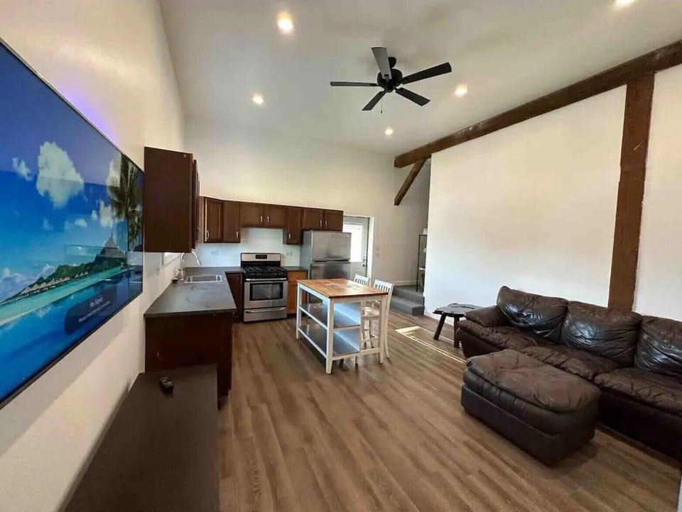 (LAUNDRY) The laundry room features a stackable washer and dryer, conveniently accessible through the bathroom.