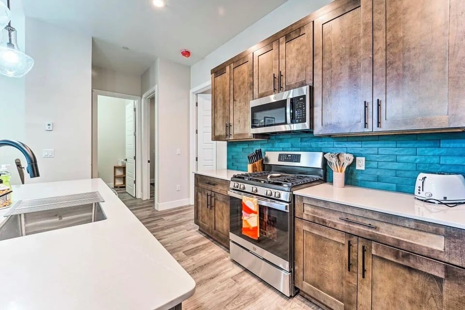 Gorgeous kitchen with amazing gas oven/stove and island sink.