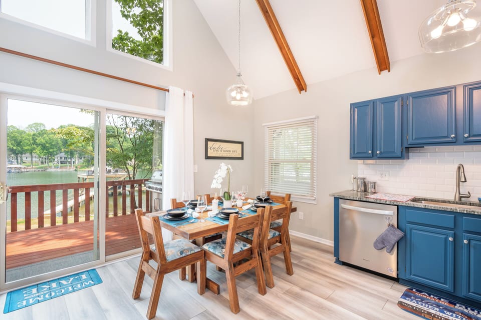 Dining area with lake views & direct access to the lakefront deck