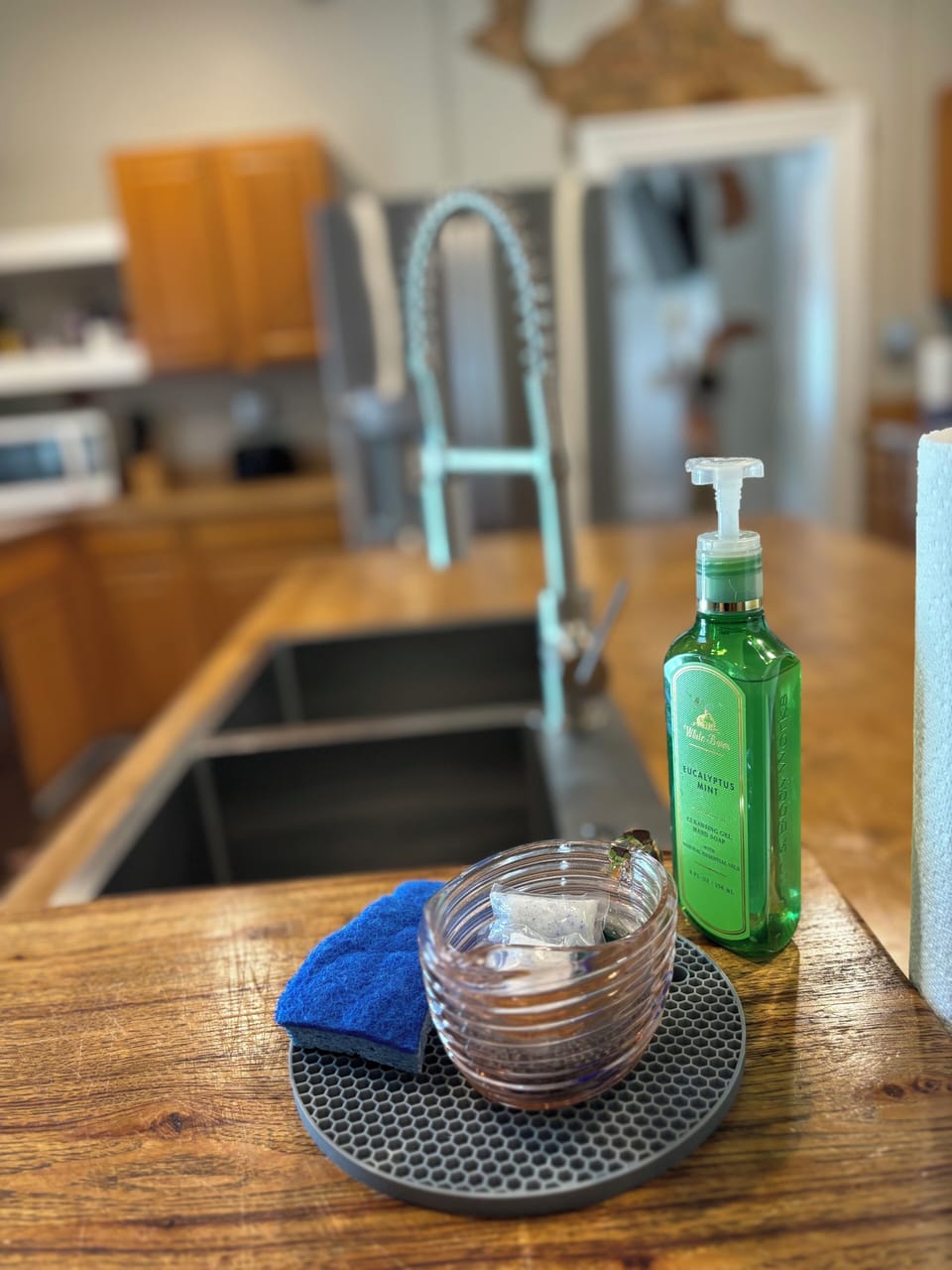Kitchen sink with soap and dishwasher soap