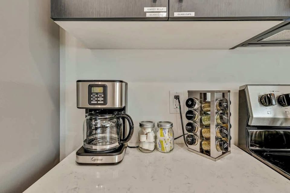 Coffee station w/ maker, mugs & essentials ready for your morning routine