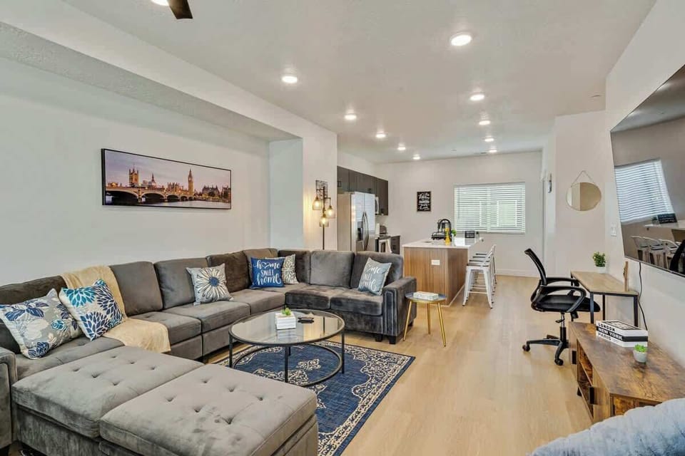 Open-concept living space connecting lounge, dining & kitchen seamlessly