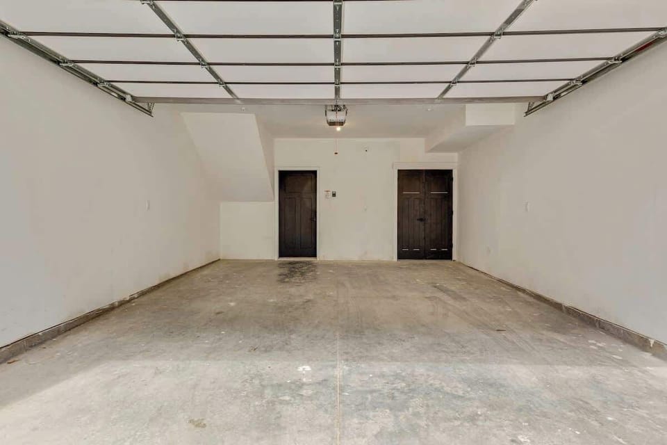 Spacious two-car garage w/ ample room for parking or storage