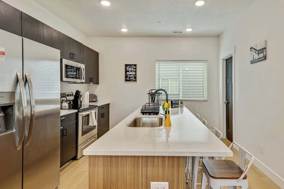 Spacious kitchen island w/ seating, perfect for cooking & gathering