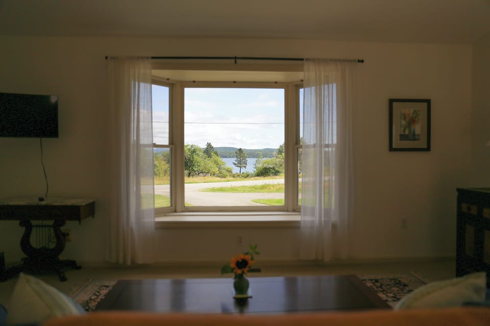 Watch the lobster boats from the living room sofa.