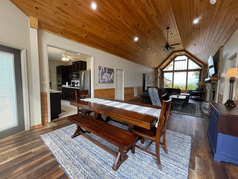 The main dining table upstairs shares both views of the east and west, capturing the sunrise and sunset lighting.