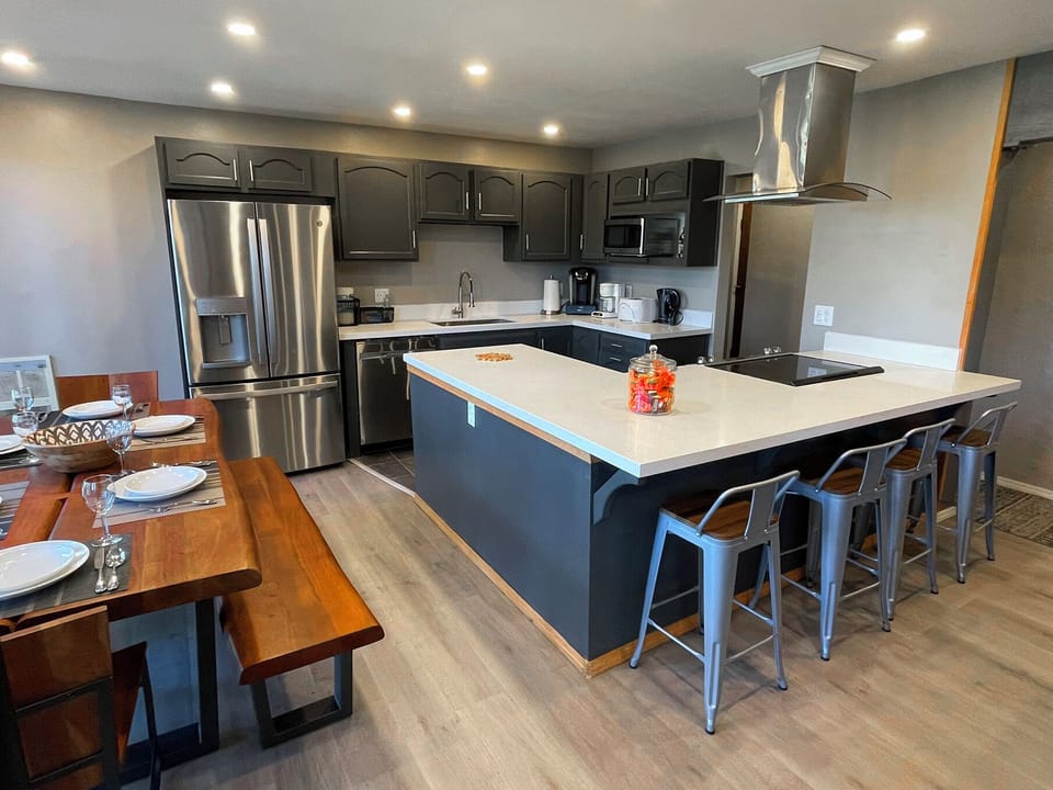 Kitchen with all the appliances, chairs at the counter, USB plugs to charge