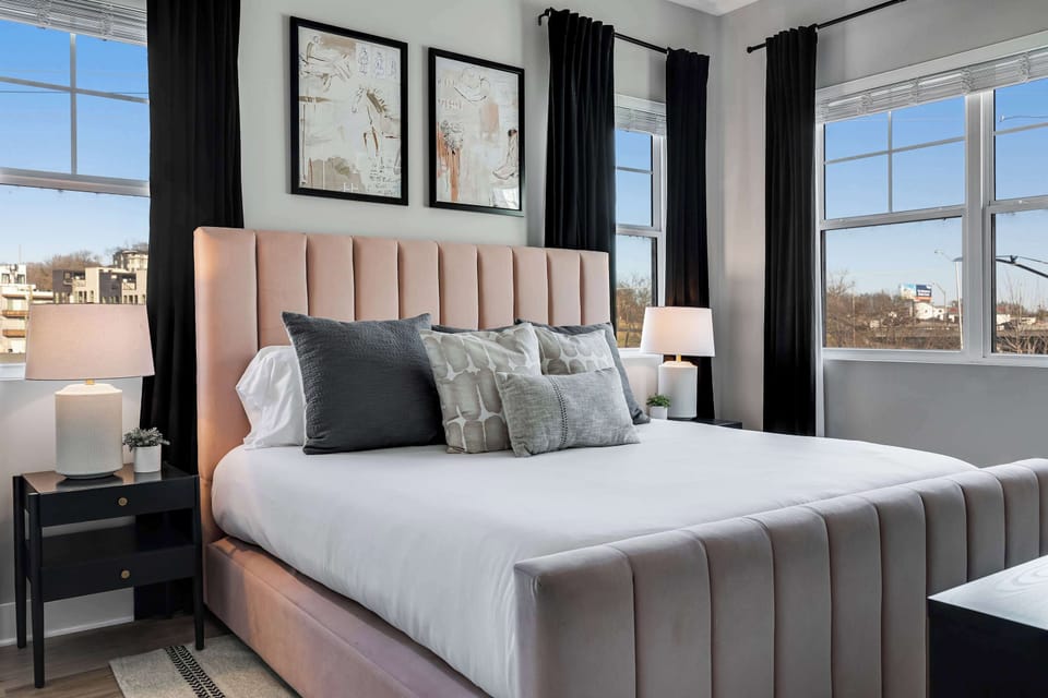 Plush king bed, modern décor, and large windows for a restful night’s sleep.