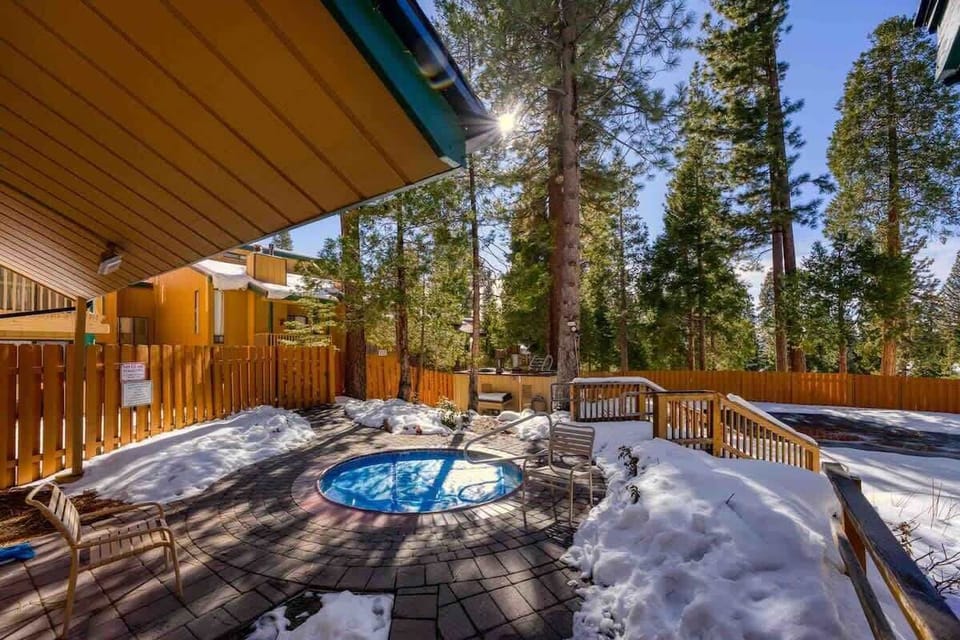 Deck with a hot tub — a great place to relax and enjoy the fresh mountain air.