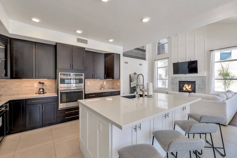 Kitchen with traditional coffee maker, microwave, stove/oven, fridge, dishwasher, utensils etc