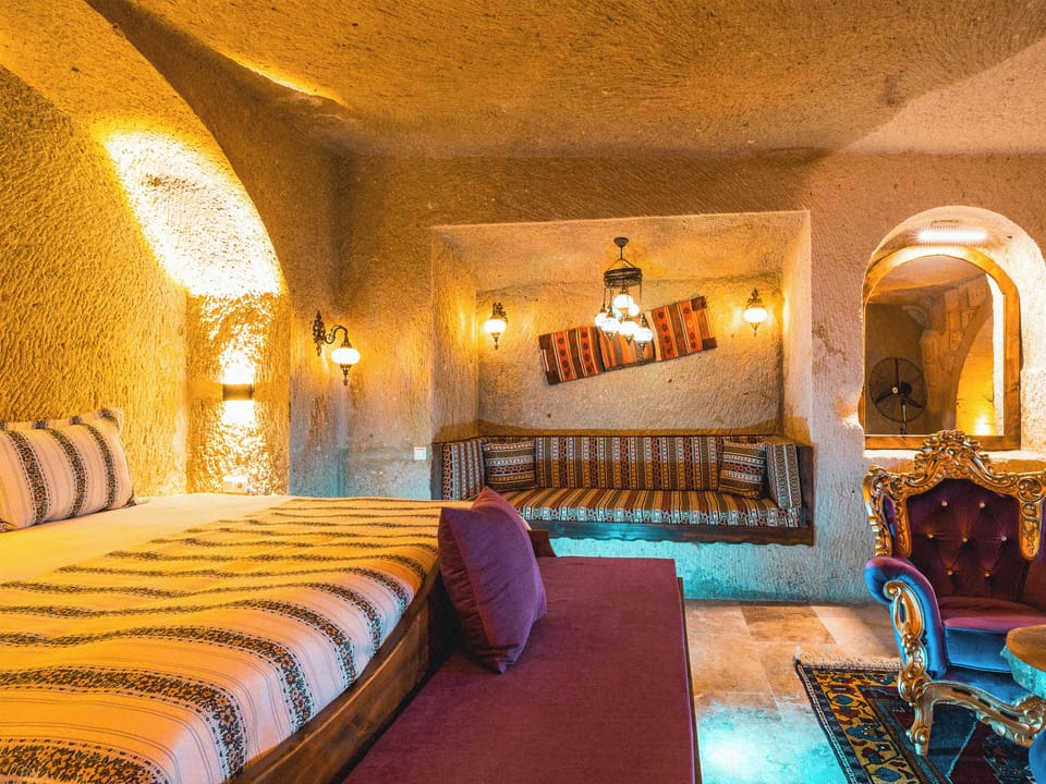 Erva Hammam Jacuzzi Cave Suite | Living area | 42-inch LCD TV with satellite channels, heated floors