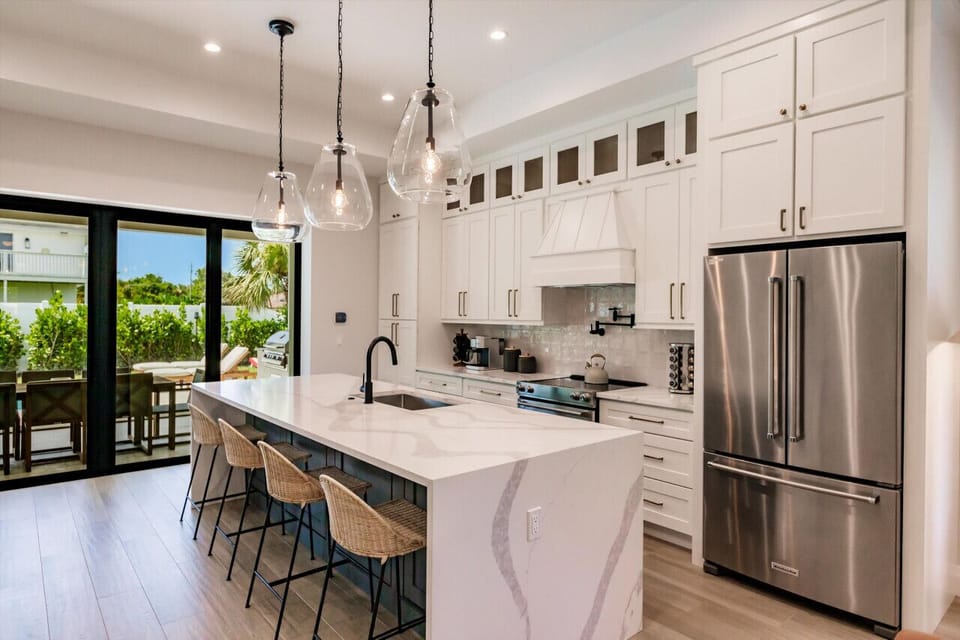 Gourmet Kitchen with Waterfall Kitchen Island.