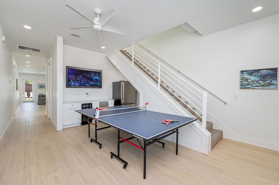 1st floor entertainment with full size fridge, bev center, freestanding ice maker, flat screen TV!