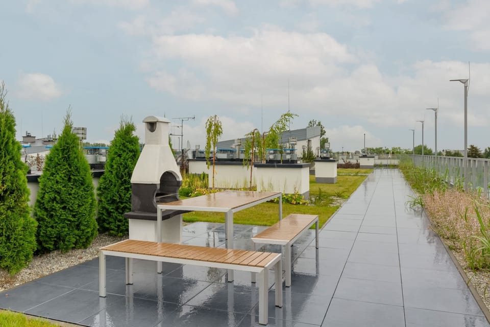 Elegant terrace with grill located in the common area.