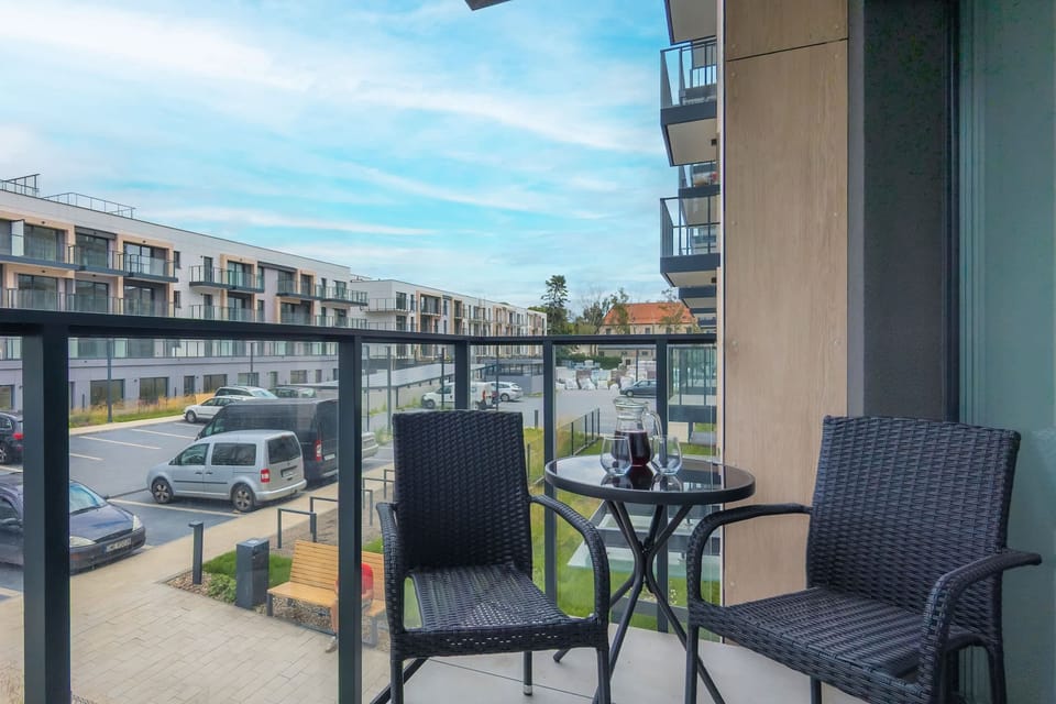The balcony provides a serene environment for relaxation. 