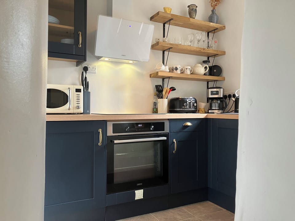 Fully fitted kitchen including dishwasher, oven, electric hob, kettle, microwave