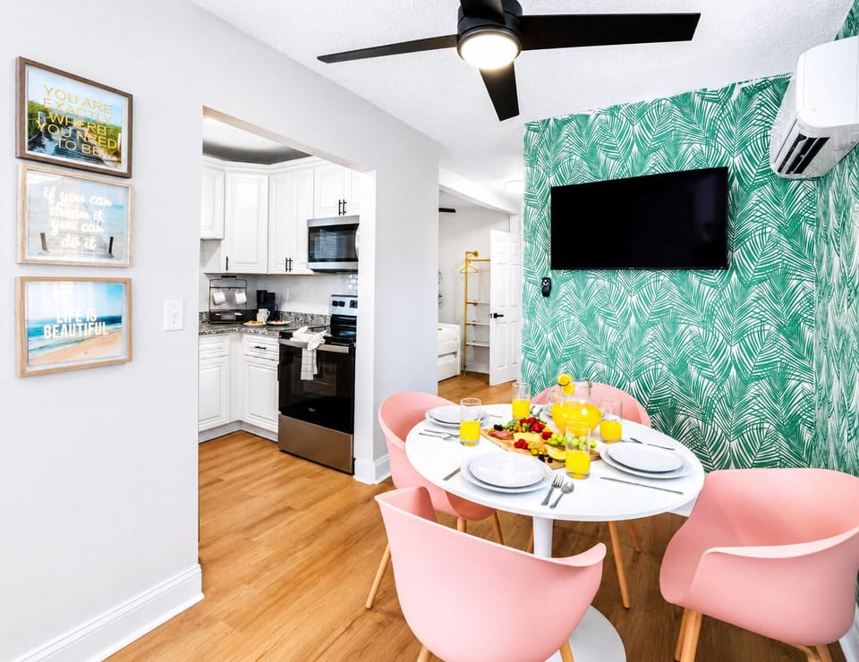 The open-concept layout seamlessly connects the dining area, living room, and fully equipped kitchen, making it easy to spend time together throughout your stay.