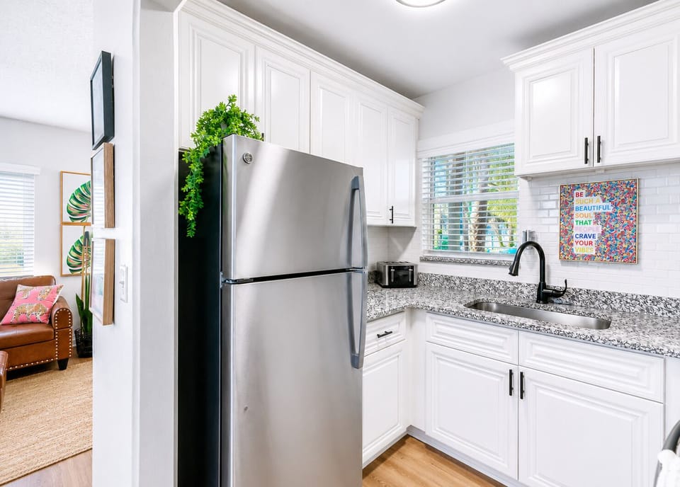 This spacious kitchen offers plenty of counter space, ample storage, and everything needed to prepare anything from quick breakfasts to family dinners.