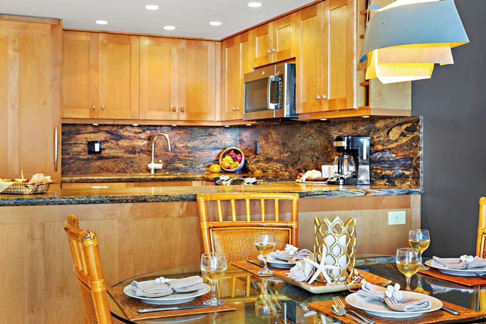 Featuring granite countertops, full-size appliances, and ample workspace, this well-appointed kitchen makes vacation dining effortless.