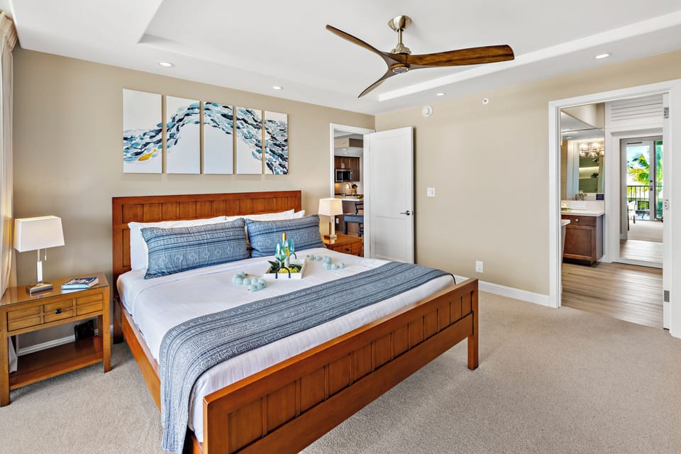 Unwind in this spacious primary bedroom, thoughtfully designed with comfort and style in mind. Soft coastal tones, refined furnishings, and a peaceful atmosphere create the perfect sanctuary after a day exploring Maui