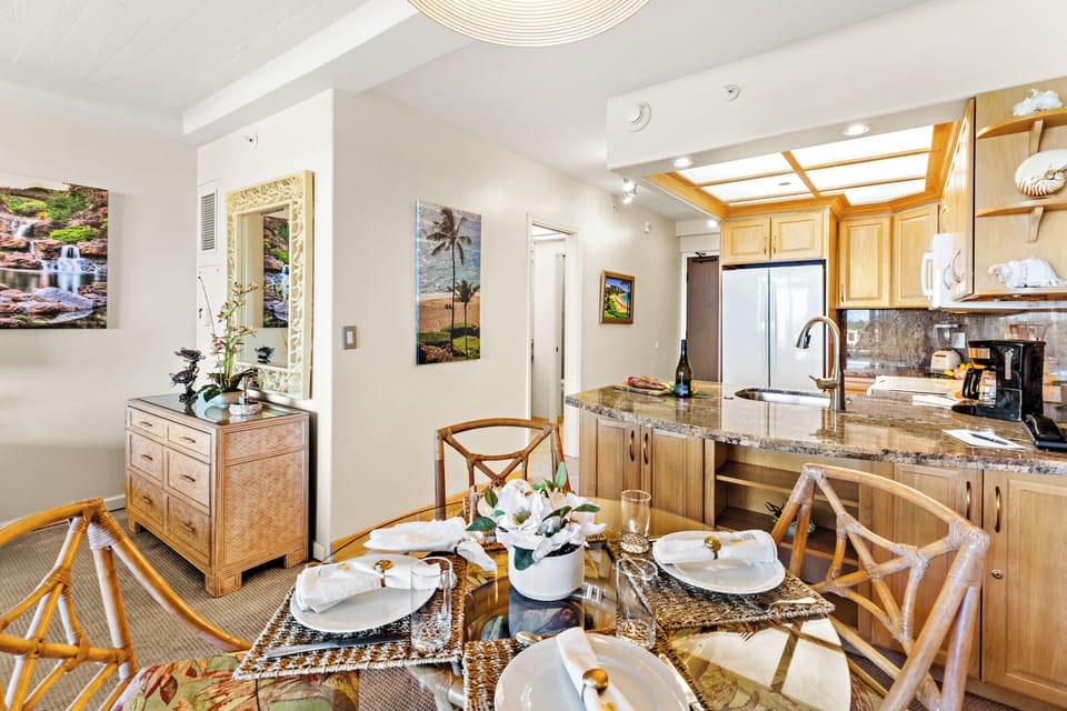 Enjoy meals together in the inviting dining area, perfectly situated between the living space and fully equipped kitchen for effortless island living.
