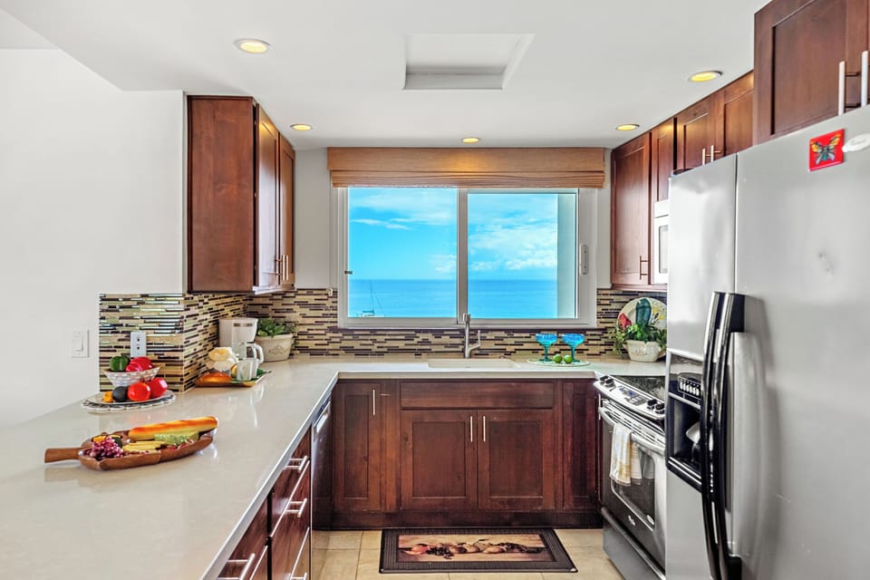 Even meal preparation feels special with stunning Pacific Ocean views showcased from this beautifully appointed kitchen.