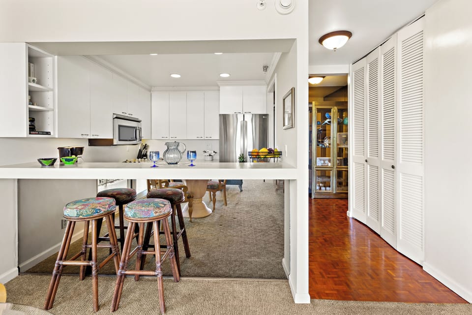 Fully equipped kitchen with a generous breakfast bar, comfortable seating, and modern appliances. Ideal for casual dining or enjoying your morning coffee before a day in paradise.