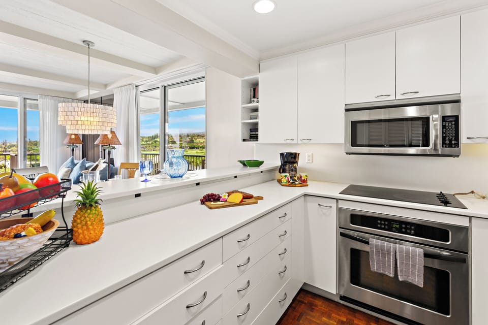 Your gourmet kitchen awaits with cabinetry, counters, and stainless-steel appliances. Perfect for preparing memorable meals together.