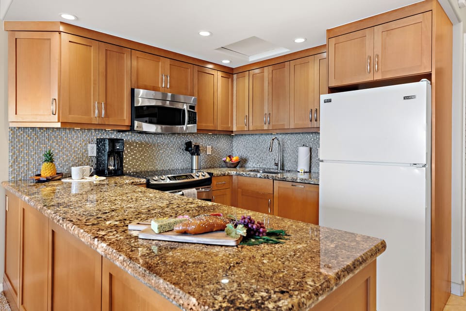 Featuring modern appliances, ample counter space, and all the essentials you need from quick island breakfasts to full home-cooked dinners.