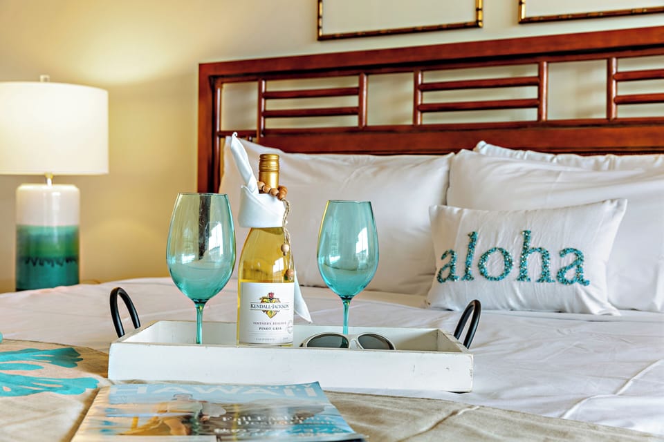 Wake up to island light and step straight out to sweeping resort views. This bright, airy bedroom opens to a private balcony, blending comfort and indoor-outdoor living in the heart of paradise.