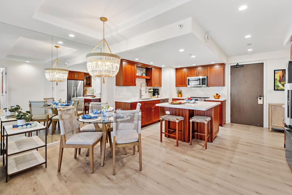 Your gourmet kitchen awaits with rich wood cabinetry, counters, and stainless-steel appliances. Perfect for preparing memorable meals together.