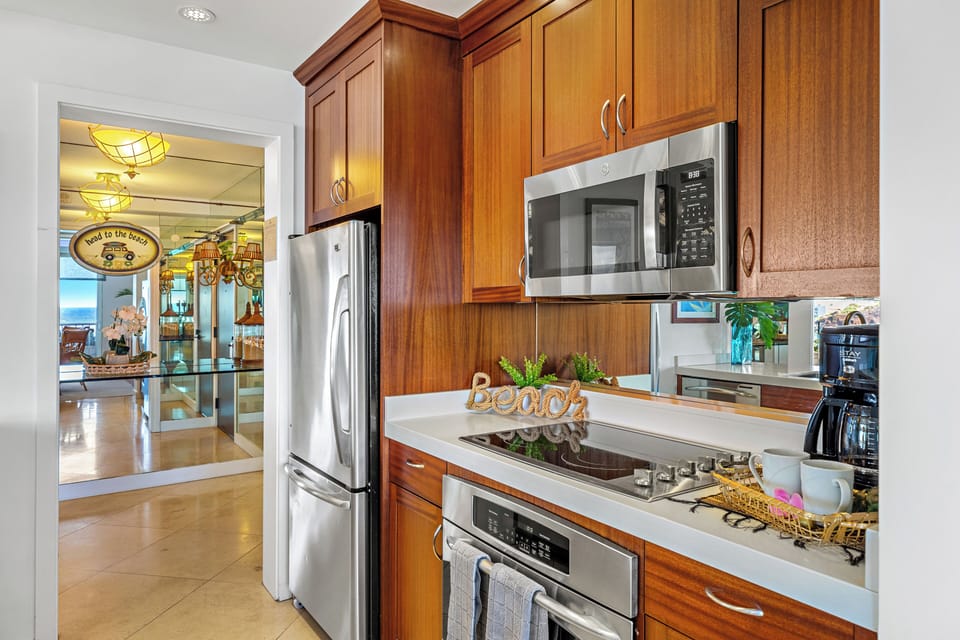 Cook with ease in a thoughtfully designed, fully equipped kitchen. Featuring modern appliances, ample counter space, and all the essentials you need, from quick island breakfasts to full home-cooked dinners.
