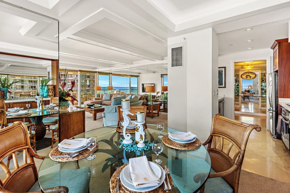 Bright and inviting open-concept kitchen featuring  cabinetry, sleek countertops, and a spacious island that flows seamlessly into the living and dining areas. Perfect for entertaining or relaxing in comfort.